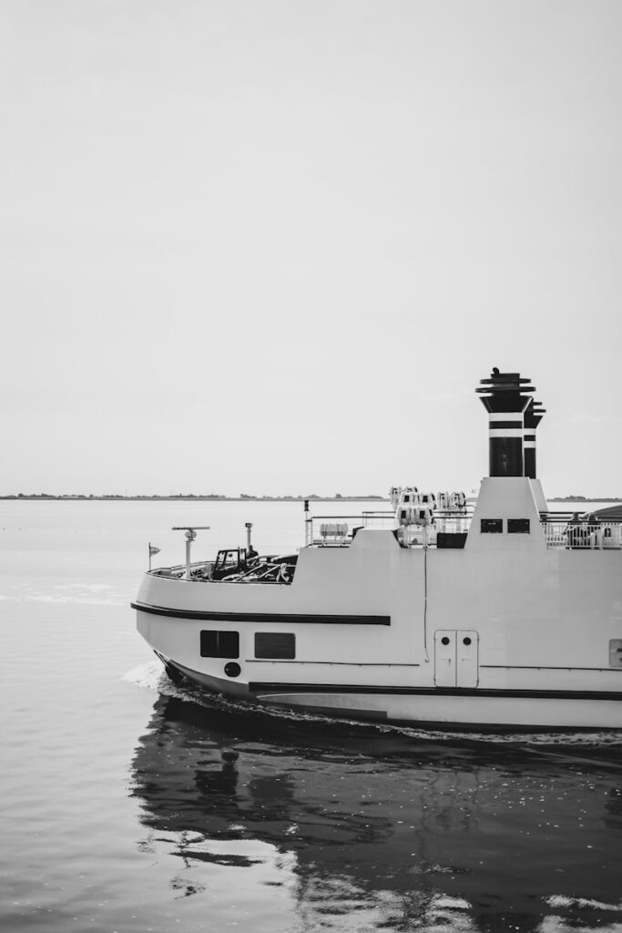A large boat floating on top of a body of water